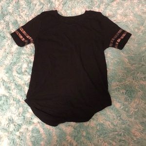 A black tee shirt with gold stripes.